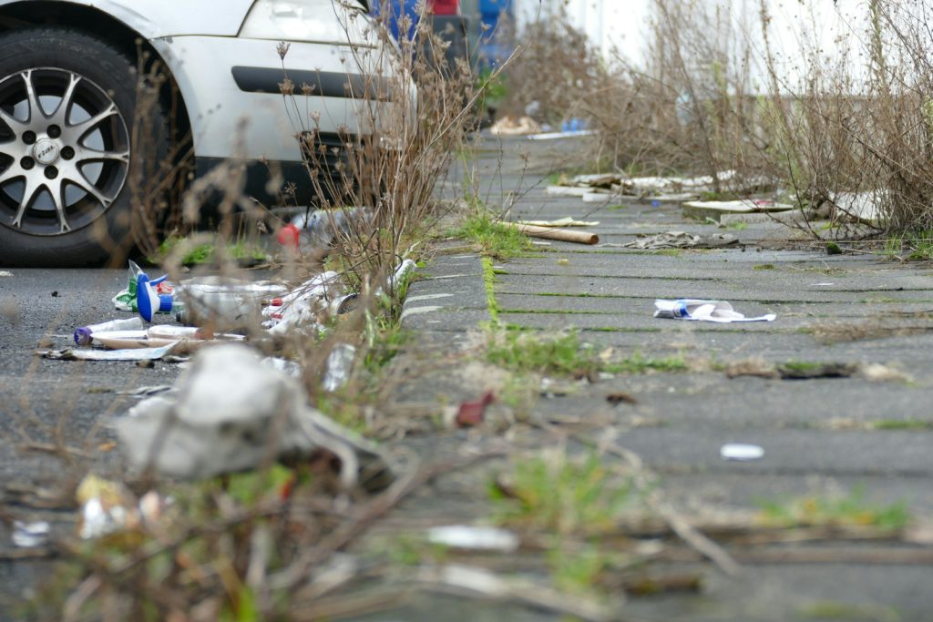 a white car parked on the side of a road