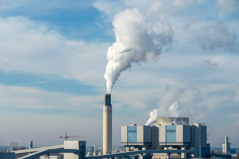 a factory with smoke coming out of it